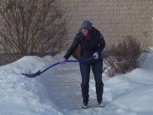 Crystal shovelling the neighbour's sidewalk...