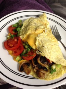 lovely omelet with mushrooms, green onions, my tomatoes, and cilantro...