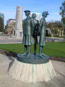 statue of women in the three services at the Manitoba Legislature building...